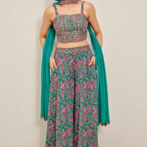 Woman wearing a teal Ishq palazzo set with coordinated kurta and flowy palazzo pants, styled for an elegant ethnic look.